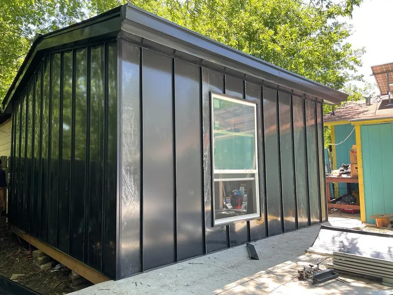 Black standing seam metal wall panels for Roof Inspection in Kirkwood